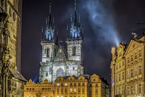 A Gothic church illuminated in the night sky