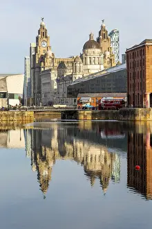 The Three Graces iconic waterfront landmark buildings reflected in water