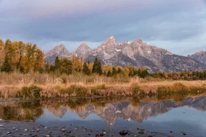 Grand Teton Range mountain range reflected in the river