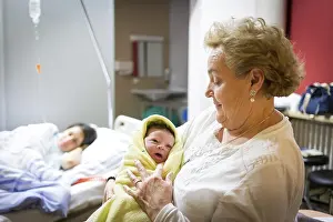Grandmother with newborn in hospital