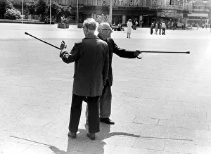 Grandpas with sticks, ca. 1980s