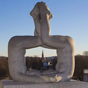 Granite sculpture, a man and a woman merging in an acrobatic pose