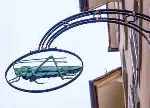 Grasshopper Symbol on a Sign in Switzerland