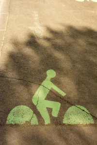 A green bicycle lane marking is visible on a city street