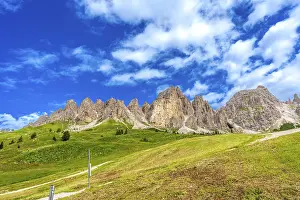 Category Mountain Landscapes Prints: Green meadows and imposing peaks of the dolomites illuminated by the summer sun