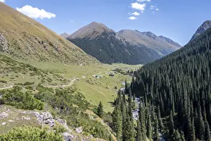 Green mountain valley with the village of Altyn Arashan