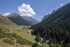Green mountain valley with the village of Altyn Arashan