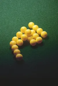 Green poker felt table cloth and ball arranged as pyramid