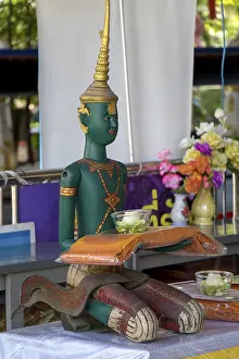 The Green Statue of God Indra in the Buddhist Monastery