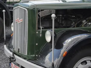 Green vintage lorry with classic radiator grille and headlights
