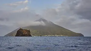 Grey clouds, Strombolichio, small volcanic rock island off Stromboli