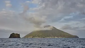 Grey clouds, Strombolichio, small volcanic rock island off Stromboli