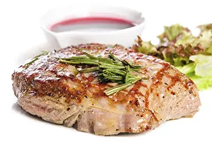 Grilled pork steaks with raspberry sauce