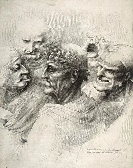 Five grotesque heads, including an elderly man with an oak leaf wreath