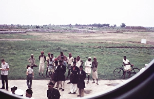 Ground staff and curious locals through the aeroplane window at Delhi airport, India, Asia, early 1960s, Asia