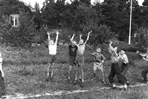 A group of boys playing outdoors, trying their best to reach the thrown ball first. 1954 Kristoffersson ref DV1