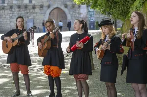 Group female university students musicians perform in street