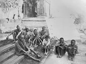 Group of leprosy patients. Sick beggars at the entrance to a temple in Rangoon