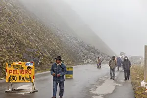 Group of people on foggy mountain road