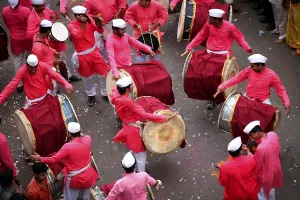 Group of traditional band playing-music on streets during immersion celebration of Lord Ganesh