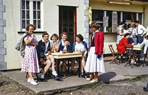 Group of young people sitting in front of a cafe, 1950 1955, England, UK