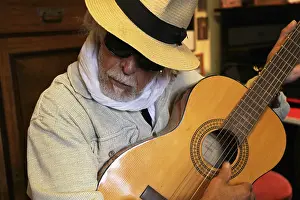 Guitar player, musician plays the guitar