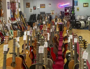 Guitars on display inside shop Sarum Guitars & Drums