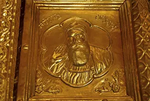 Guru nanak emboss on thin gold plate and fitted on door gurudwara of sachkhand sahib