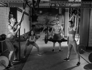 Gym group weightlifting workout men and girls exercise