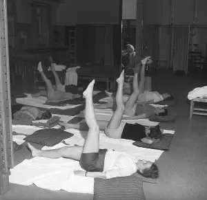 Gymnastics in the past. In a gymnasium