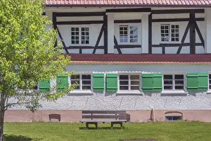 Half-timbered facade with green shutters
