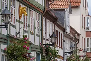 Half-timbered facades with stylish details and golden decoration in a historic setting
