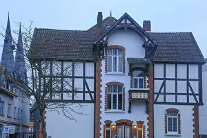 Framed Print : Half-timbered house, rear towers of St Nicolai church