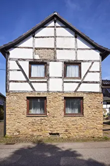 Half-timbered house on a sandstone plinth in the district of Pesch