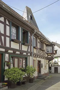 Half-timbered house and spire of the clock tower