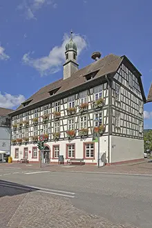 Half-timbered house and town hall with spire