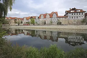Half-timbered houses on the Fulda with reflection