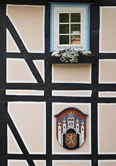 Half-timbered houses with town coat of arms