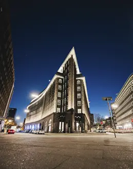 Hamburg, Germany, Triangular building illuminated at night