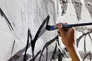 Hand paint wall with brush, street art