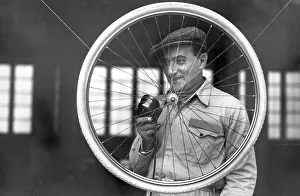 Handicraft, man with bicycle tyre