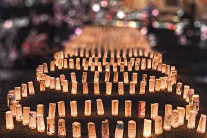 Handmade japanese washi paper lanterns aligned in circles illuminating the ground of the Zojoji temple near the Tokyo