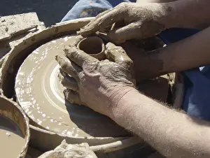 Framed Print : Hands of master potter and apprentice on potter's wheel Hands of master potter and apprentice on potter's wheel