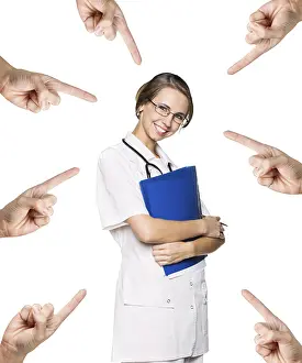 Many hands points on the medical doctor woman with stethoscope