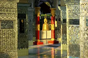 Hanging bell inbetween mirroring pillars on top of Mandalay Hill Burma