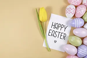 Happy Easter text card surrounded by colorful pink