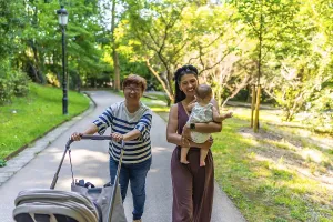 Happy latin family walking in a park