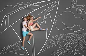 Happy valentines love story concept of a romantic couple on chalk drawings background