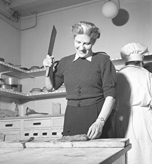 Happy woman in the kitchen in 1948