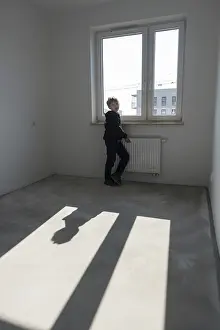 Framed Print : Happy young boy in his new empty room in the new flat in Wroclaw Framed Print : Happy young boy in his new empty room in the new flat in Wroclaw